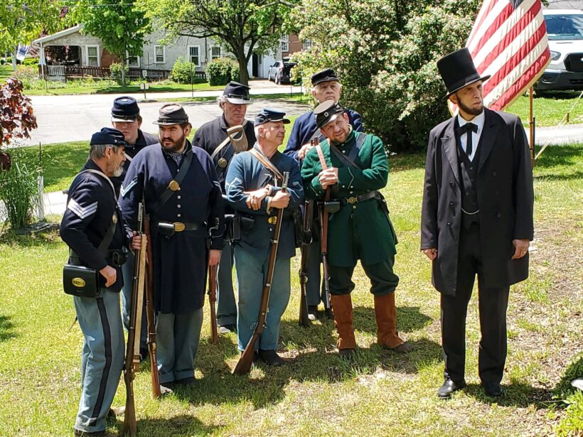 Civil War reenactors with historical American flag.