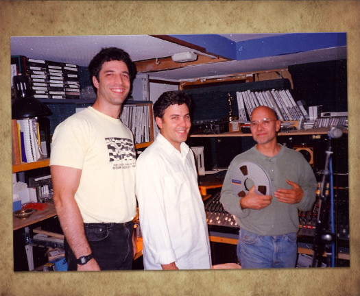 Three men in a recording studio.