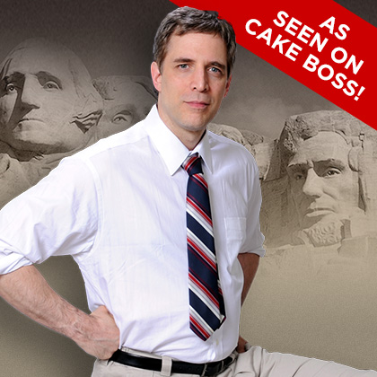 Man in shirt and tie, Mount Rushmore background.